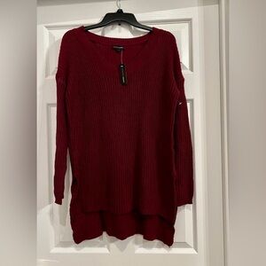 Women’s Ambiance Apparel Burgundy sweater. Size Small. High low style.
